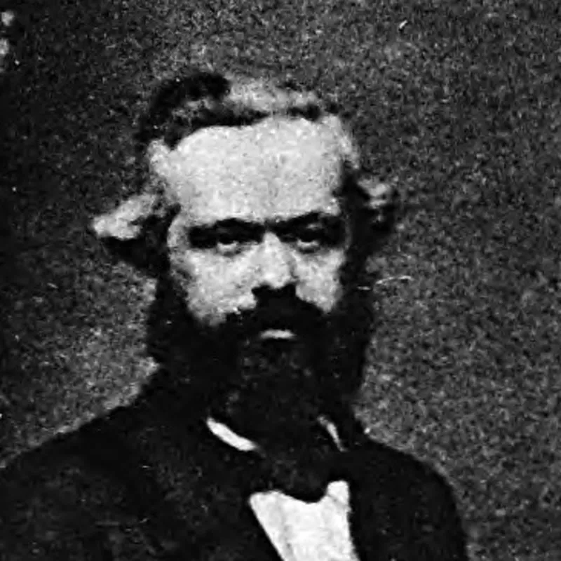 Karl Marx en mai 1861, photographie de Richard Beard : barbe noire, regard droit.