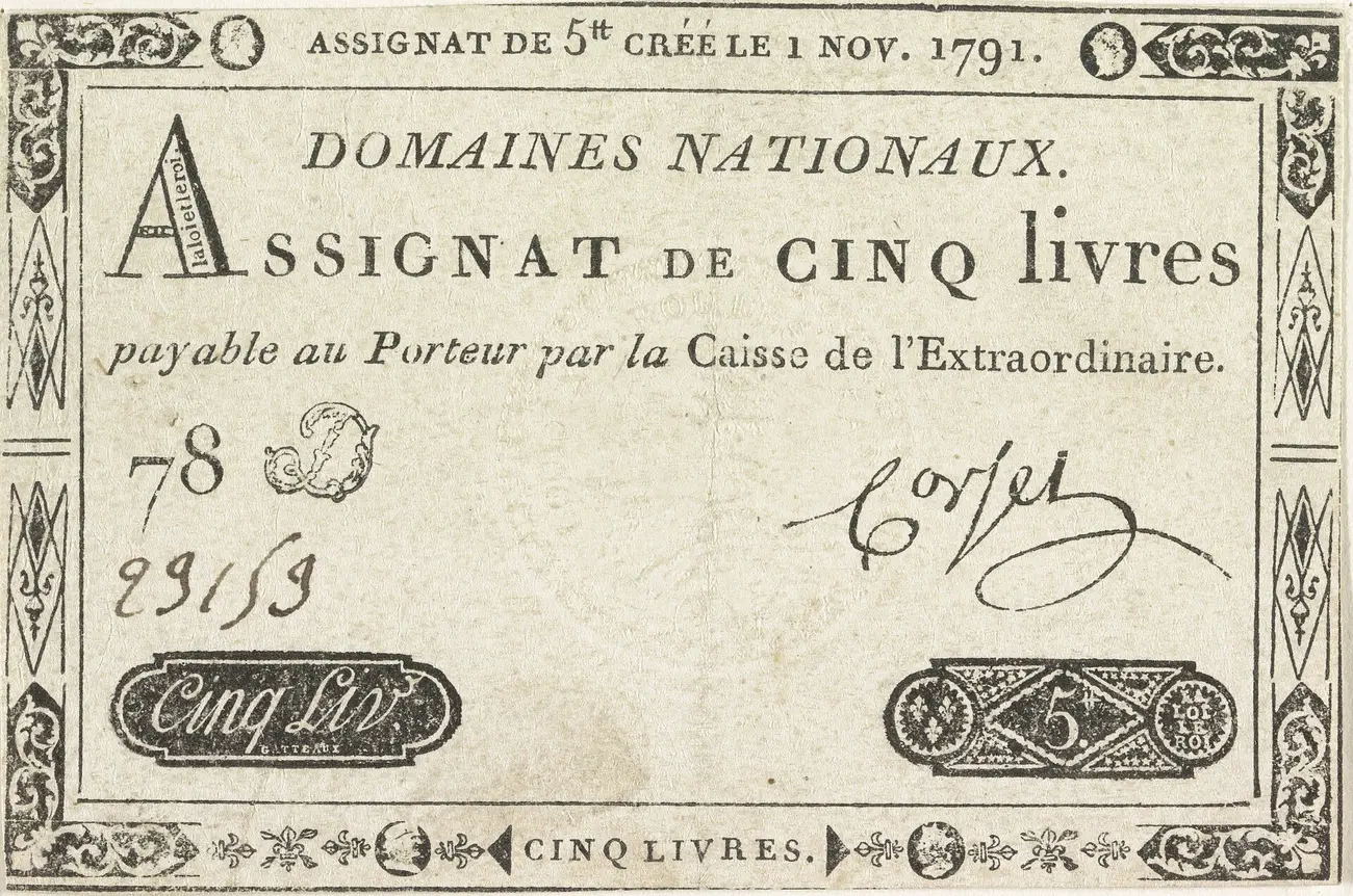 Un assignat de cinq livres créé le 1er novembre 1791 : un billet imprimé au nom des Domaines nationaux, payable au porteur par la Caisse de l'Extraordinaire, numéroté et signé à la main.